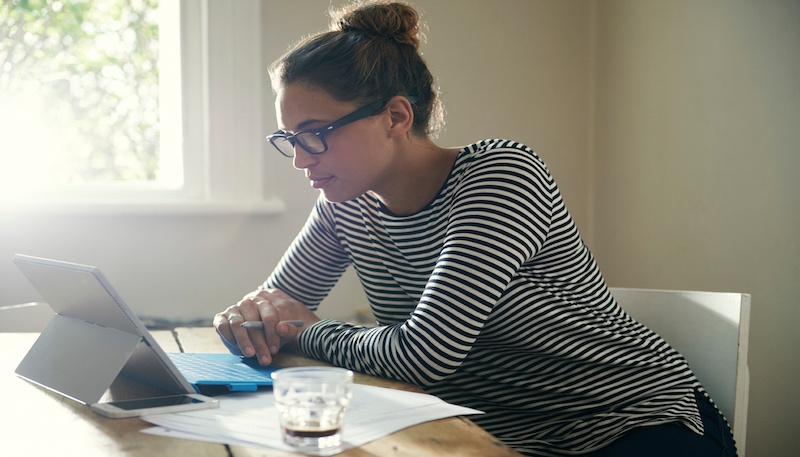 Woman_Evaluating_Health_Insurance_Options.jpg
