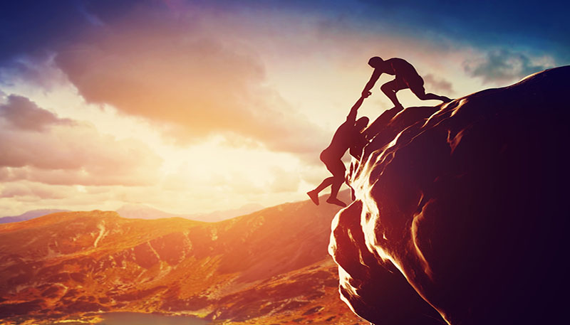 bigstock-Hikers-climbing-on-rock-mount-66403036.jpg