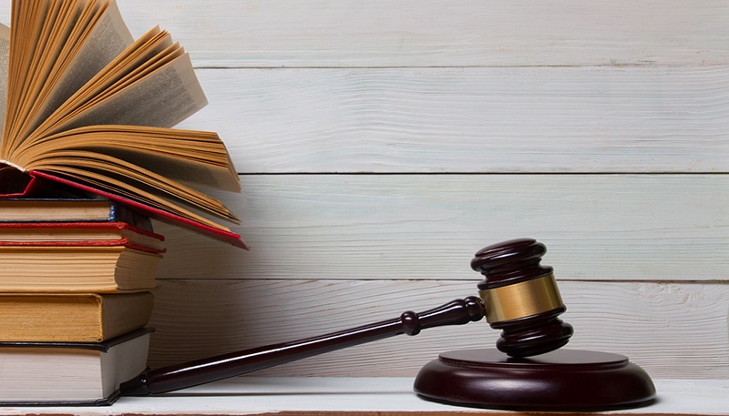 bigstock-Law-book-with-wooden-judges-ga-117005726.jpg