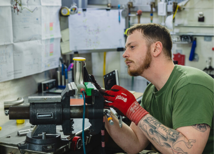 An employee working at a manufacturing company