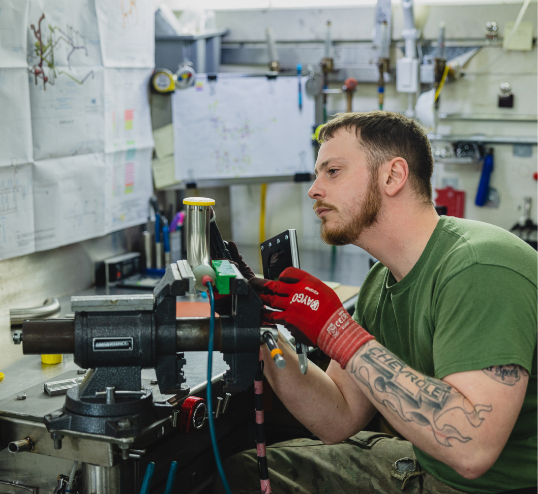 An employee working at a manufacturing company