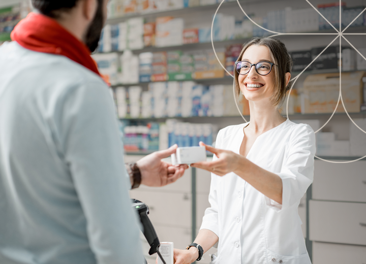 an image of a man receiving prescription medication from a pharmacy